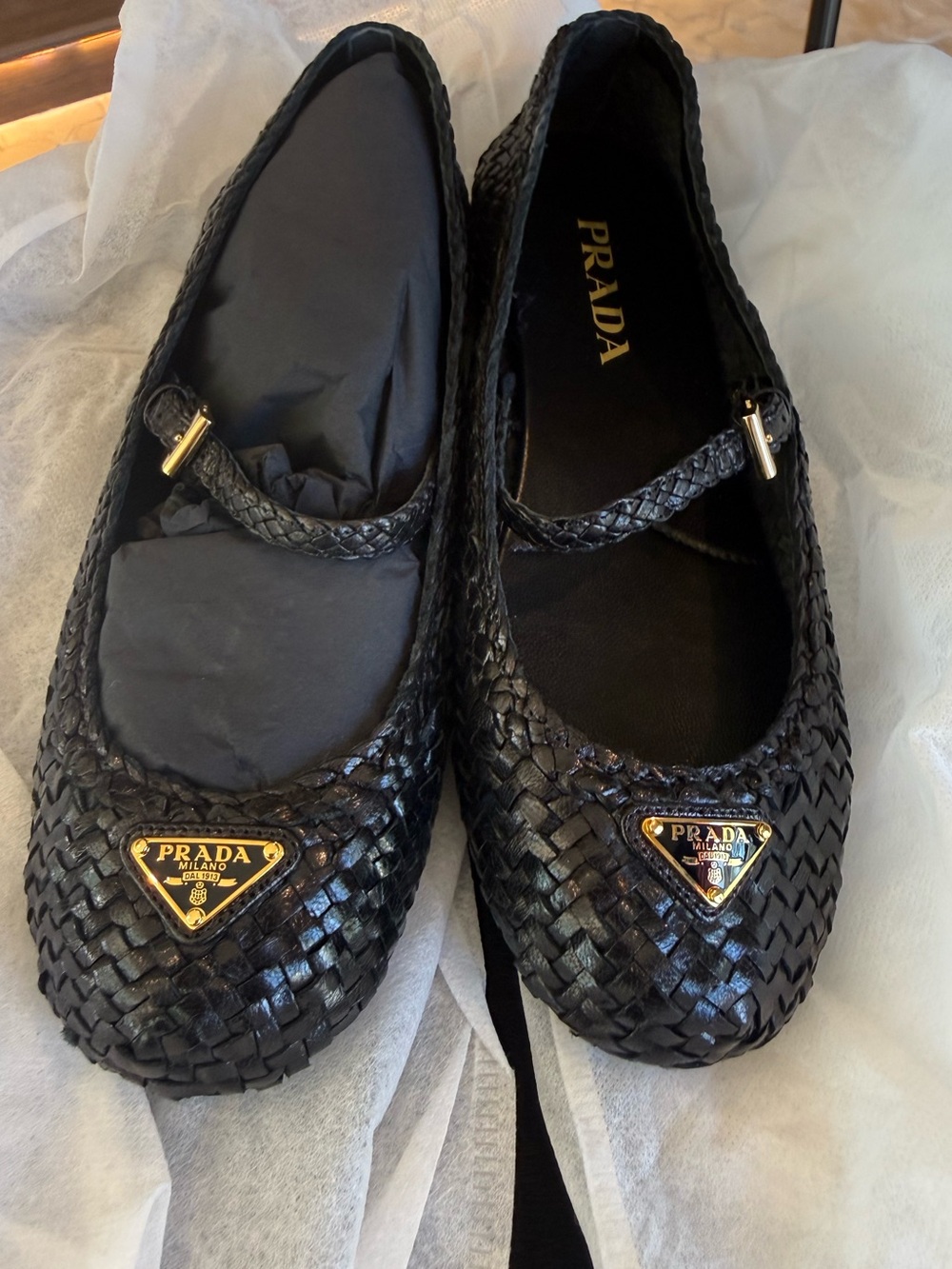 Prada Black Woven Leather Mary Jane Flats with Gold Triangle Logos